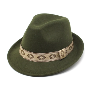 Detail of dark green wool felt hat with geometric patterned light brown decorative band