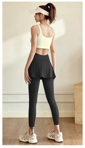 Back view of high-elasticity fitness set featuring beige sports bra and black skirt-leggings