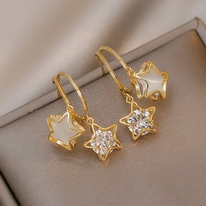 Minimalist gold star stud earrings with white cat-eye stone and sparkling cubic zirconia