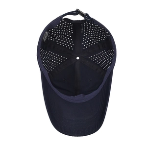 Dark blue breathable cotton baseball cap with laser-cut ventilation holes and internal view