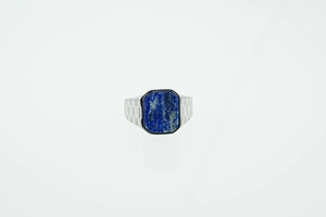Detail of square blue lapis lazuli stone on a silver steel ring with textured sides