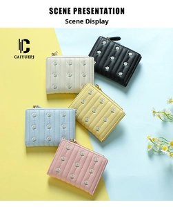 Short quilted women's wallets with floral embroidery in black, cream, yellow and blue