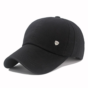 Detailed view of the black cotton baseball cap with a silver metal fashion logo plate