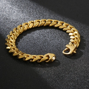 Macro shot of gold Cuban link bracelet showing high-polished surface and lobster clasp