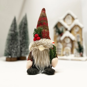 Christmas gnome plush with knitted hat holding pine branch for holiday festive decor