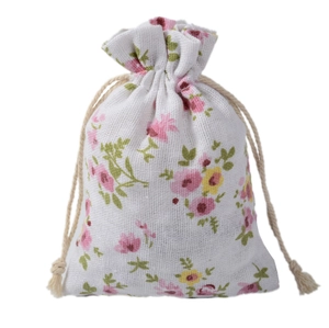 Close-up of cotton linen drawstring pouch showing pink floral patterns and fabric texture