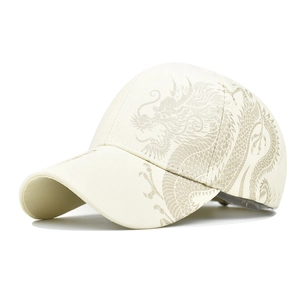 Detailed close-up of a dragon pattern printed on a high-quality beige cotton baseball cap