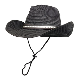 Detail of black cowboy straw hat with metal star band and adjustable chin strap