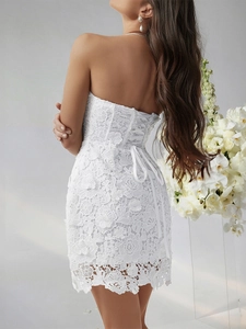 Elegant white lace mini dress with corset-style back lacing and 3D floral embroidery
