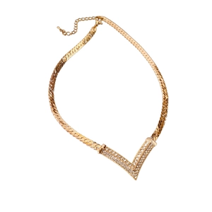 Vintage gold plated V-shaped necklace with rhinestones on a snake chain choker
