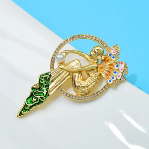Vintage fairy brooch with green enamel wings and pearl detail in matte gold finish