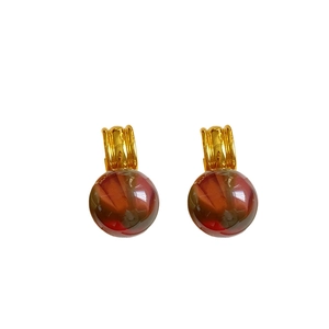 Irregular resin pendant earrings with gold C-shape hooks and deep red-brown beads