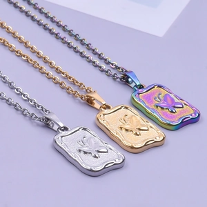 Rainbow and gold stainless steel butterfly pendant necklaces on purple background