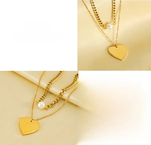 Detail of titanium steel double-layer necklace with pearl and heart pendant