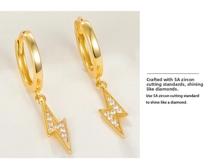 Detail view of gold-plated lightning hoop earrings with sparkling 5A cubic zirconia stones