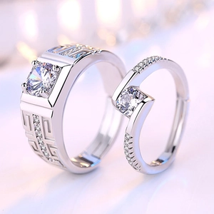 Silver couples ring set featuring square and round center stones with geometric patterns