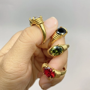 Set of four 18K gold plated stainless steel rings with colorful oval gemstones