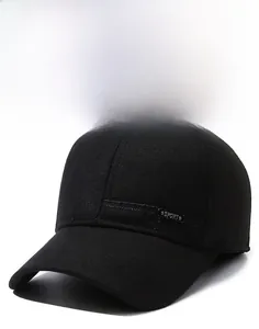 Close-up of a black winter baseball cap showing texture and a sport metal side logo