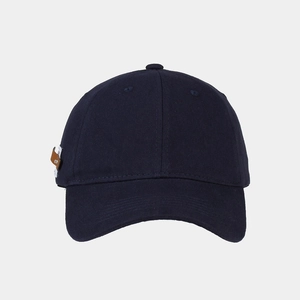 Detail of the twill cotton fabric and navy blue cap texture with side leather tag