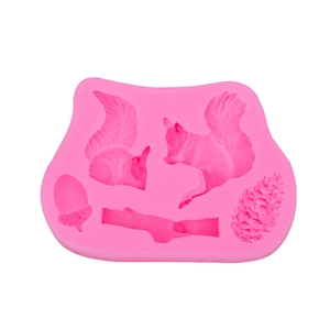 Pink silicone mold featuring squirrel and pinecone shapes for cake decorating and baking