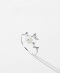 Detailed view of S925 sterling silver camellia ring with zircon and shell flower