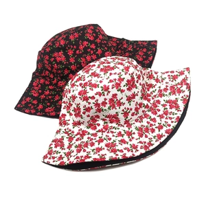 Floral reversible bucket hat for men and women with red flower patterns in black and white