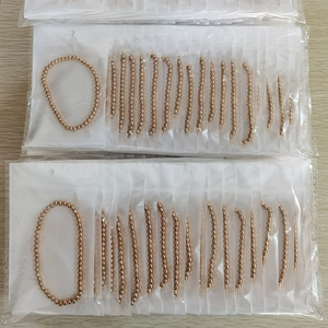 Bulk package of gold beaded bracelets with polished rose gold stainless steel finish