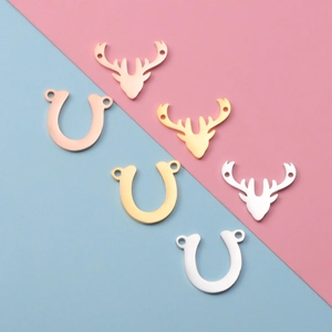 Polished stainless steel deer head and horseshoe connectors in gold silver and rose gold