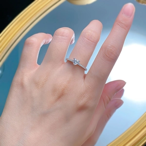 Elegant heart-cut S925 silver ring with pavé-set diamonds on a model's hand