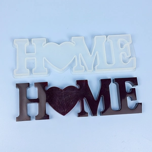 Silicone HOME letter and heart resin mold with a smooth deep reddish-brown finished piece
