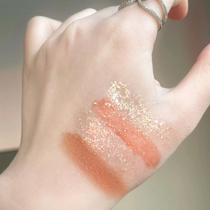 Macro shot of 26-color eyeshadow swatches showing matte, shimmer, and glitter textures