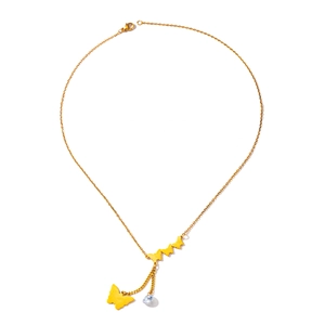 Detail of layered gold butterfly necklace with dangling charms and clear zircon stones