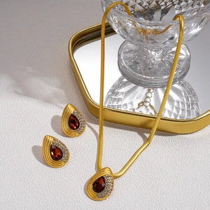 Retro gold snake chain necklace and teardrop red gemstone earrings jewelry set