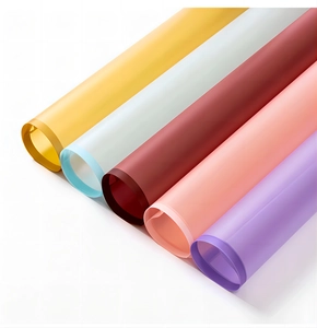 Macro view of five colorful rolls of translucent matte waterproof floral wrapping paper
