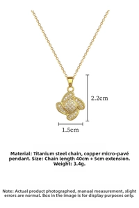 Detailed view of gold clover necklace with zircon pave and technical dimensions