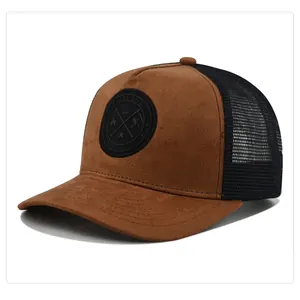 Detail view of brown suede truck hat with black mesh and circular enjoy life patch