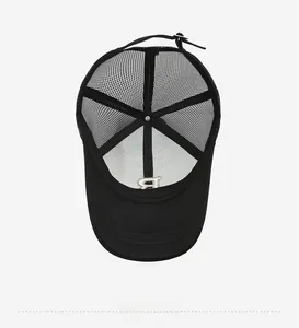 Internal structure of mesh trucker hat showing embroidered B logo and adjustable metal buckle