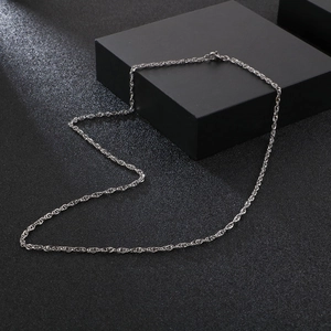 Polished stainless steel double buckle necklace set displayed on a sleek black stand