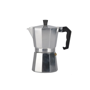 Close-up of a polished silver aluminum Moka pot with ergonomic black handle and knob