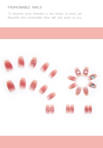 Detail of pink gradient press-on nails with 3D heart charms and sparkling rhinestones