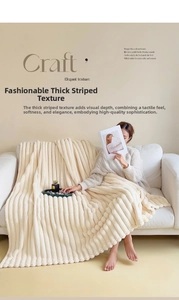 Close-up of thick cream white striped flannel blanket with a soft faux fur texture