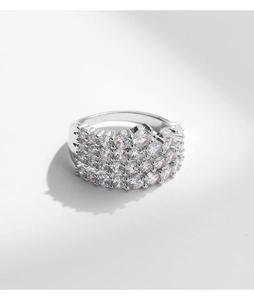 Macro shot of silver ring featuring multi-row pave setting with sparkling clear gemstones