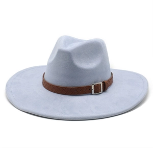 Close-up of a wide brim suede fedora hat featuring a brown woven leather band and buckle