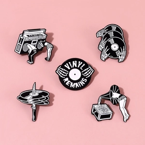 5-piece set of retro music enamel pins featuring skeletal hands and vinyl record designs