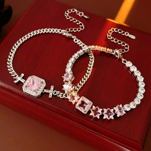 Close-up of pink zircon bracelets with heart and square cuts on a vintage jewelry box