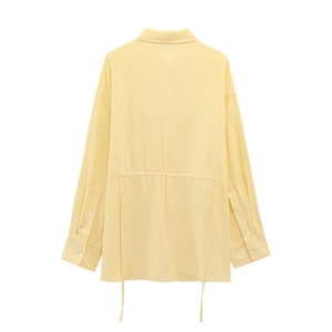 Detail view of back drawstring waist on pale yellow long sleeve casual cotton linen shirt