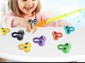 Close-up of colorful plastic googly eye finger rings for kids funny novelty toys
