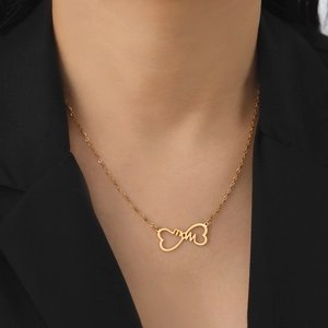 Elegant gold titanium MOM necklace with heart and infinity symbol worn by model