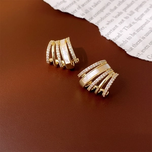 Elegant gold-plated geometric claw earrings with pavé crystals and mother of pearl inlays