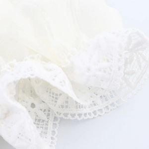 White puff sleeve crop top with lace stitching and hollow embroidery detail